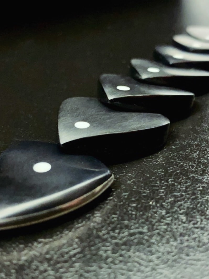 custom handmade guitar picks made of peek and titanium