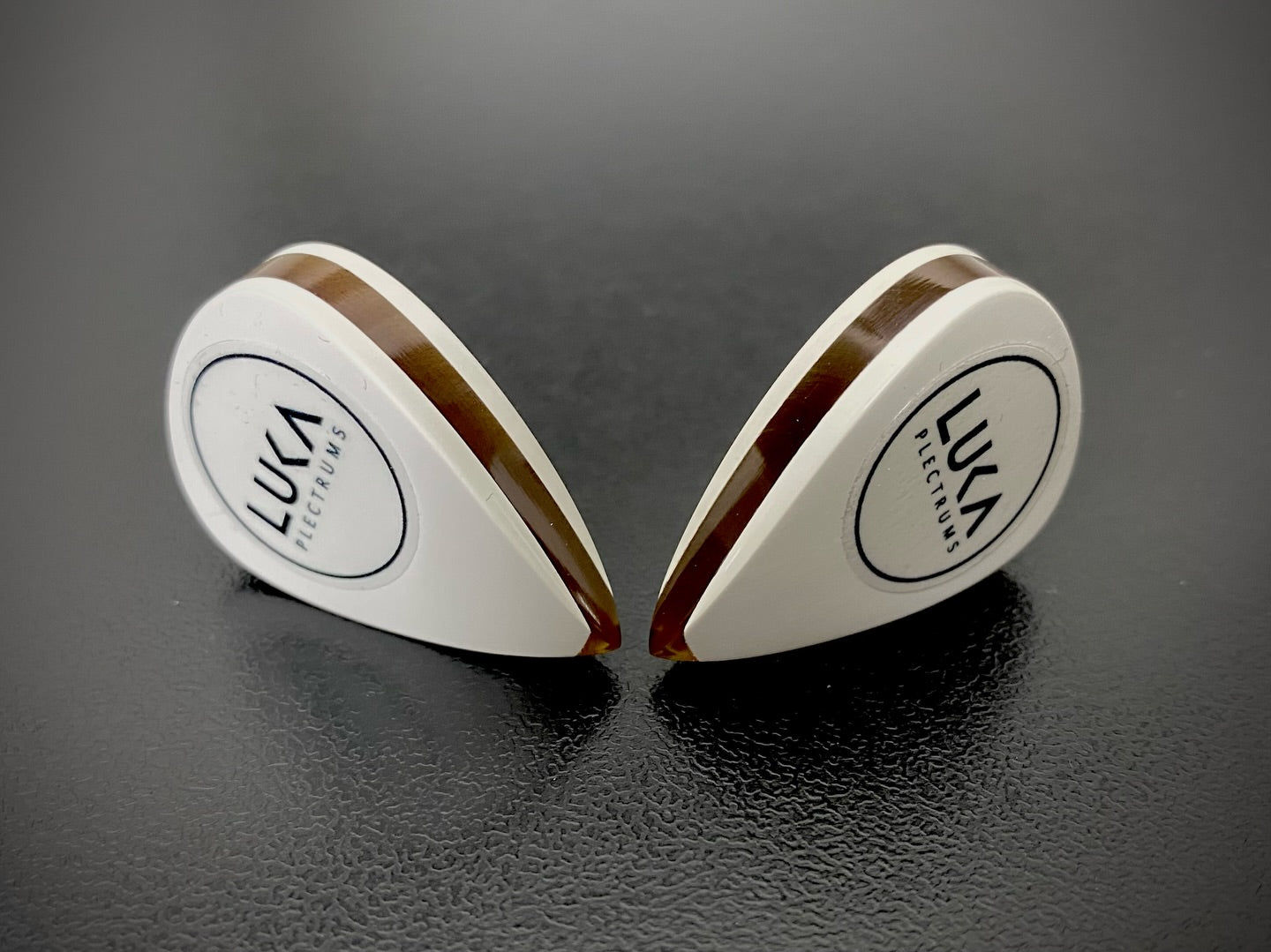 White ceramic-reinforced PEEK. Amber Ultem core. 8mm of absolute tone