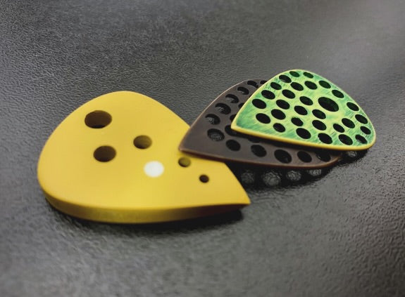 A trio of custom builds of high-performance polymer plectrums