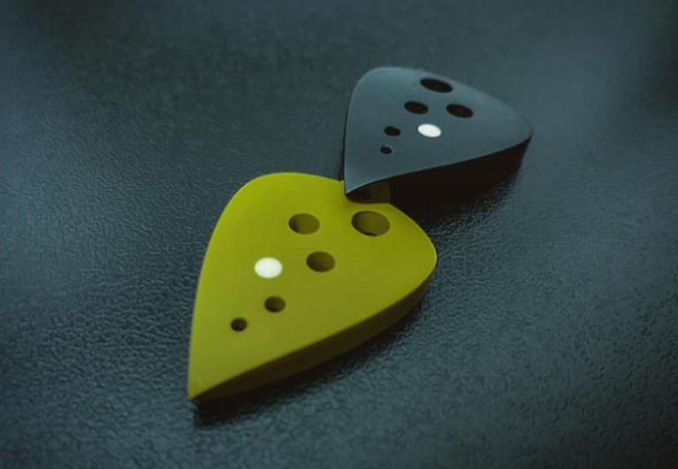 Modern Teardrop Guitar Pick – PEEK/Torlon, Drilled Holes, Glow-in-the-Dark
