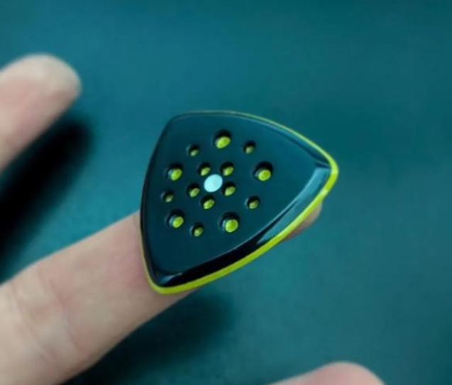Modern Triangle Guitar Pick – Torlon, Peek, Glow-in-the-Dark Core